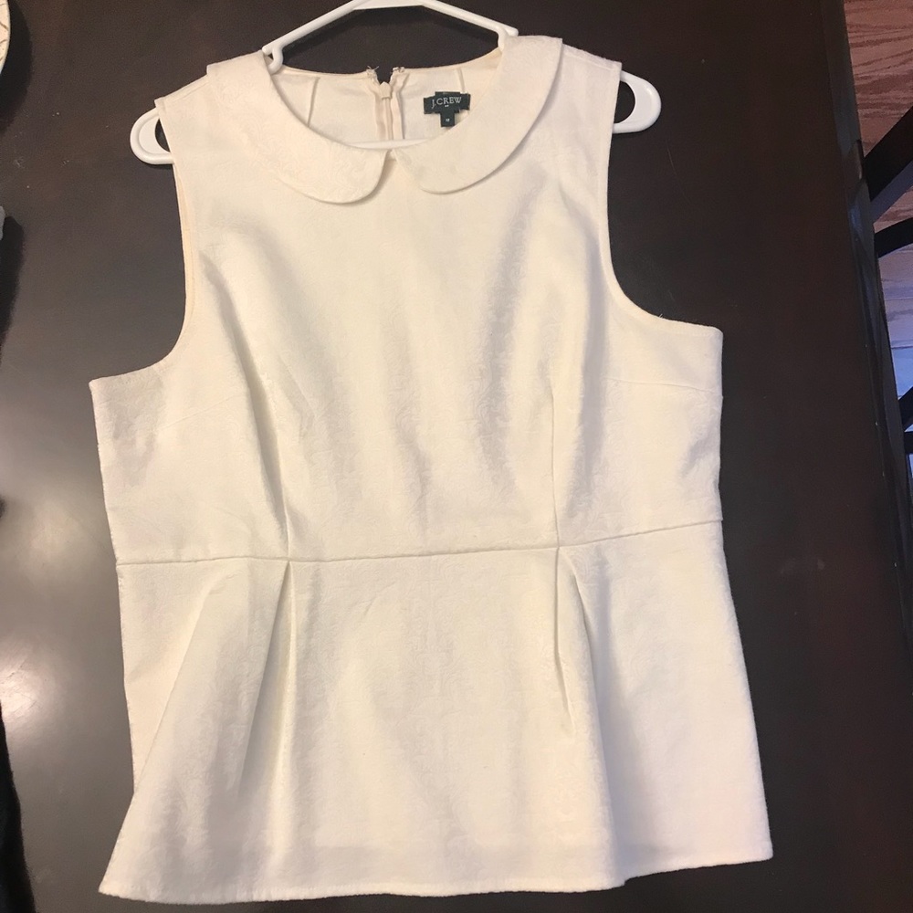 White peplum shirt.